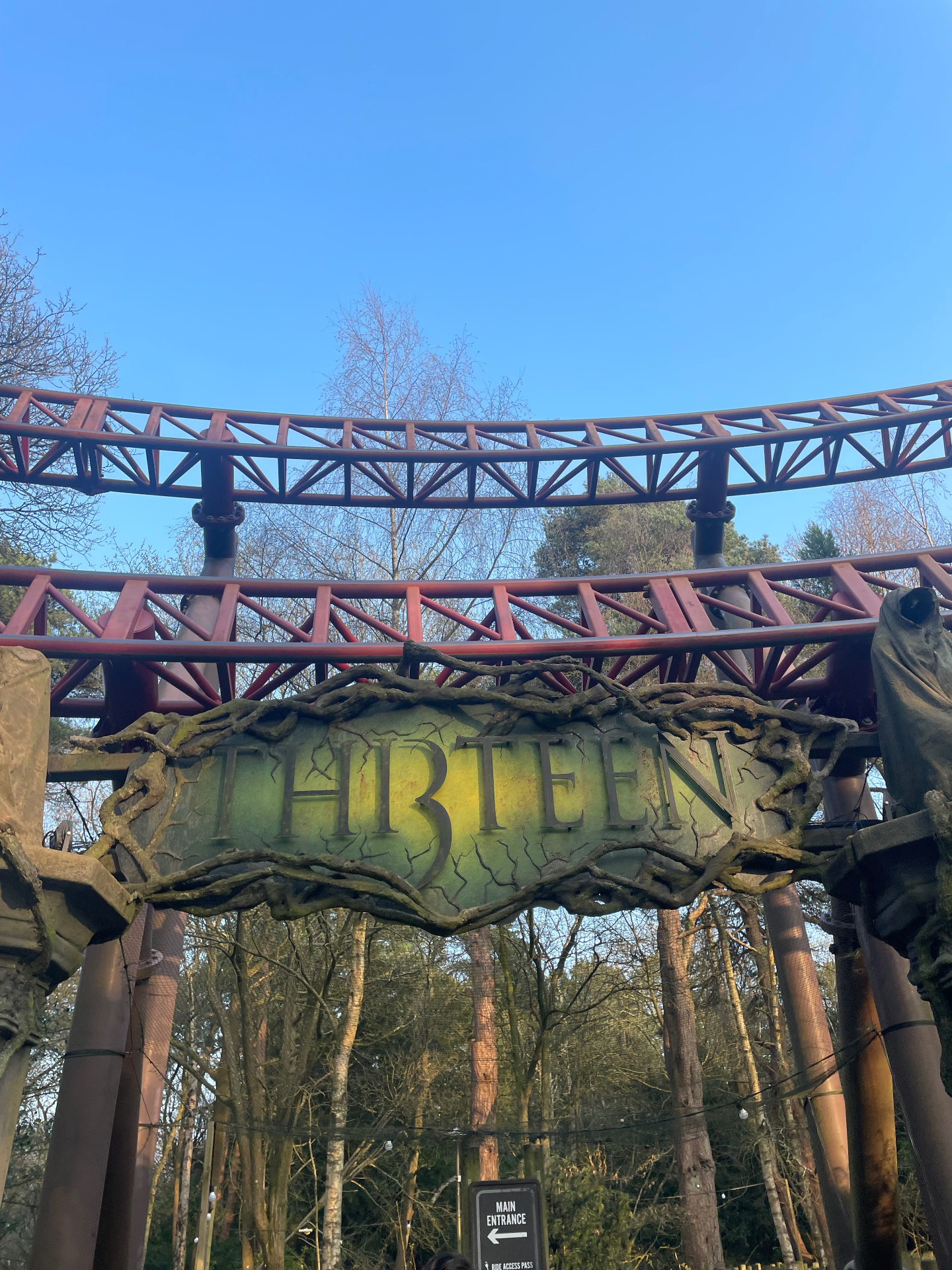 The Thirteen entrance sign in Dark Forest at Alton Towers